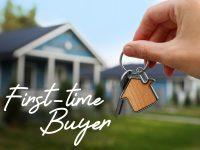 First-time buyer. Woman holding house keys outdoors, closeup
